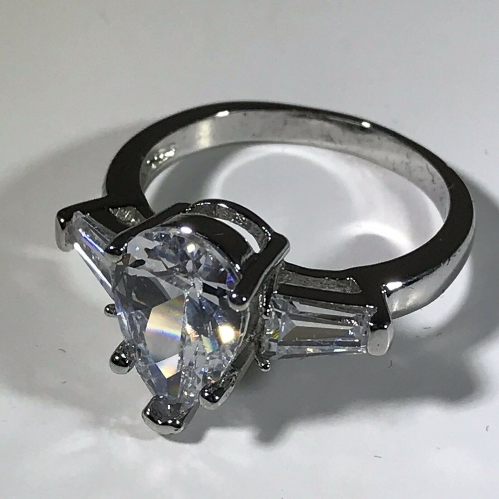 Pear Cut CZ Ladies With 2 Side Stones Ring Size 7.